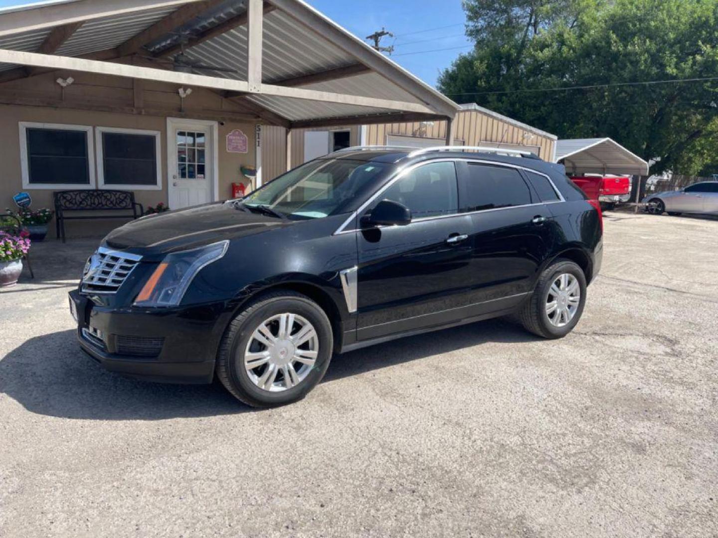 2015 BLACK CADILLAC SRX LUXURY COLLECTION (3GYFNBE35FS) with an 3.6L engine, Automatic transmission, located at 124 Elm St., Cibolo, TX, 78108, (210) 658-3118, 29.559427, -98.232384 - Photo#0