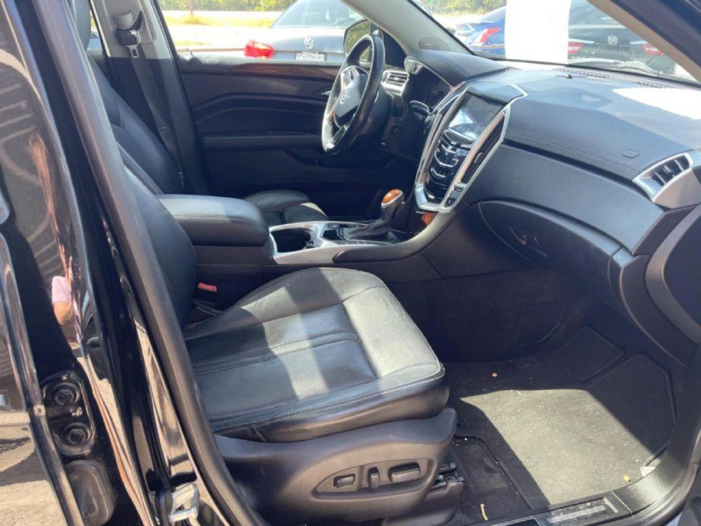 2015 BLACK CADILLAC SRX LUXURY COLLECTION (3GYFNBE35FS) with an 3.6L engine, Automatic transmission, located at 124 Elm St., Cibolo, TX, 78108, (210) 658-3118, 29.559427, -98.232384 - Photo#8