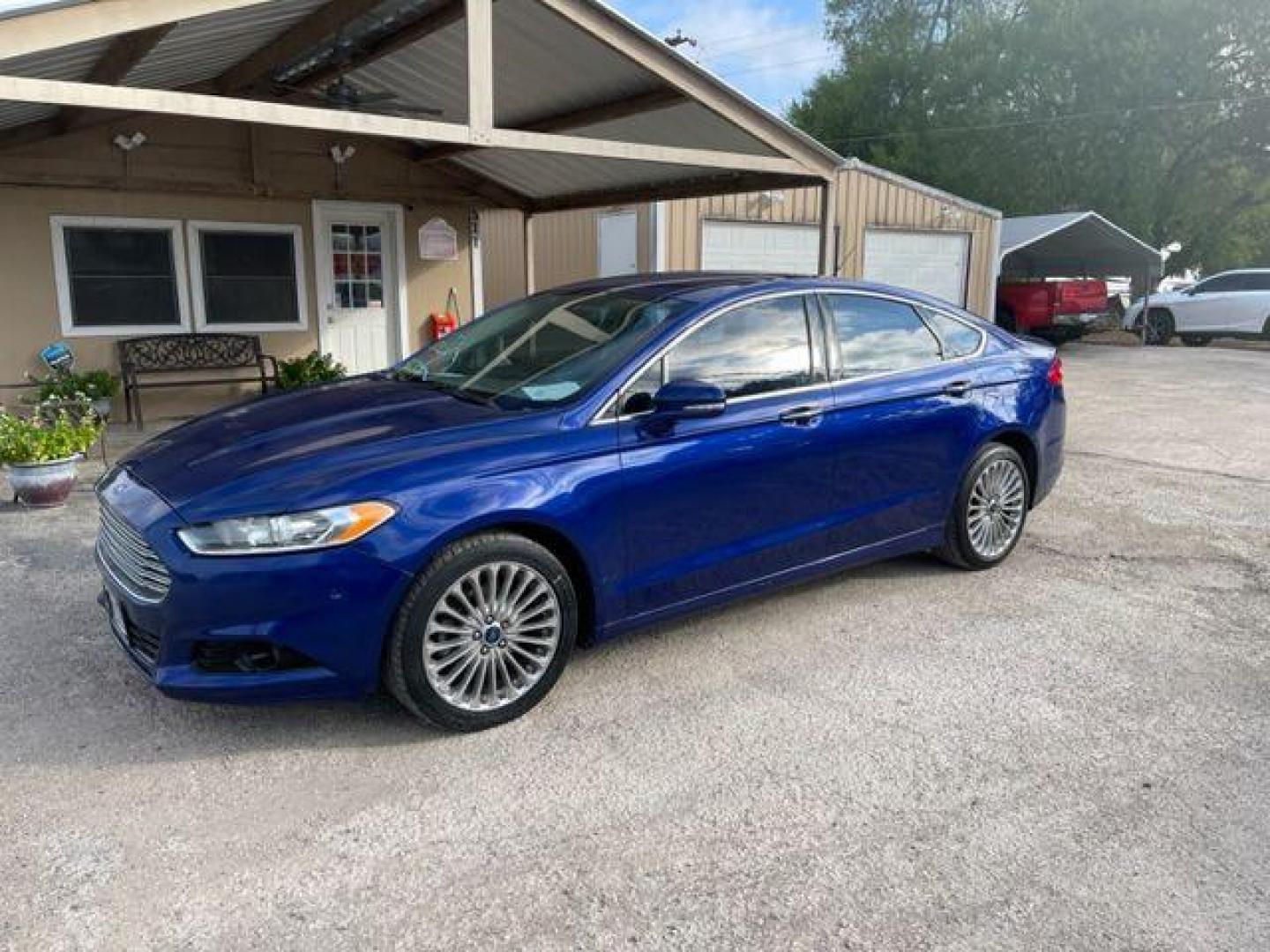 2014 BLUE FORD FUSION TITANIUM (3FA6P0D94ER) with an 2.0L engine, Automatic transmission, located at 124 Elm St., Cibolo, TX, 78108, (210) 658-3118, 29.559427, -98.232384 - www.discountautosinc.com TEXT QUESTIONS TO 210-900-3118 41 MONTHLY PAYMENTS OF $340 WITH $2495 DOWN AND FINAL ODD PAYMENT OF $25.03 W/FIRST PAYMENT DUE 30 DAYS FROM DATE OF SALE. FEATURES: ALL WHEEL DR, BACK UP CAMERA, HEATED LEATHER SEATS WARRANTY ON ENGINE and TRANSMISSION O - Photo#0