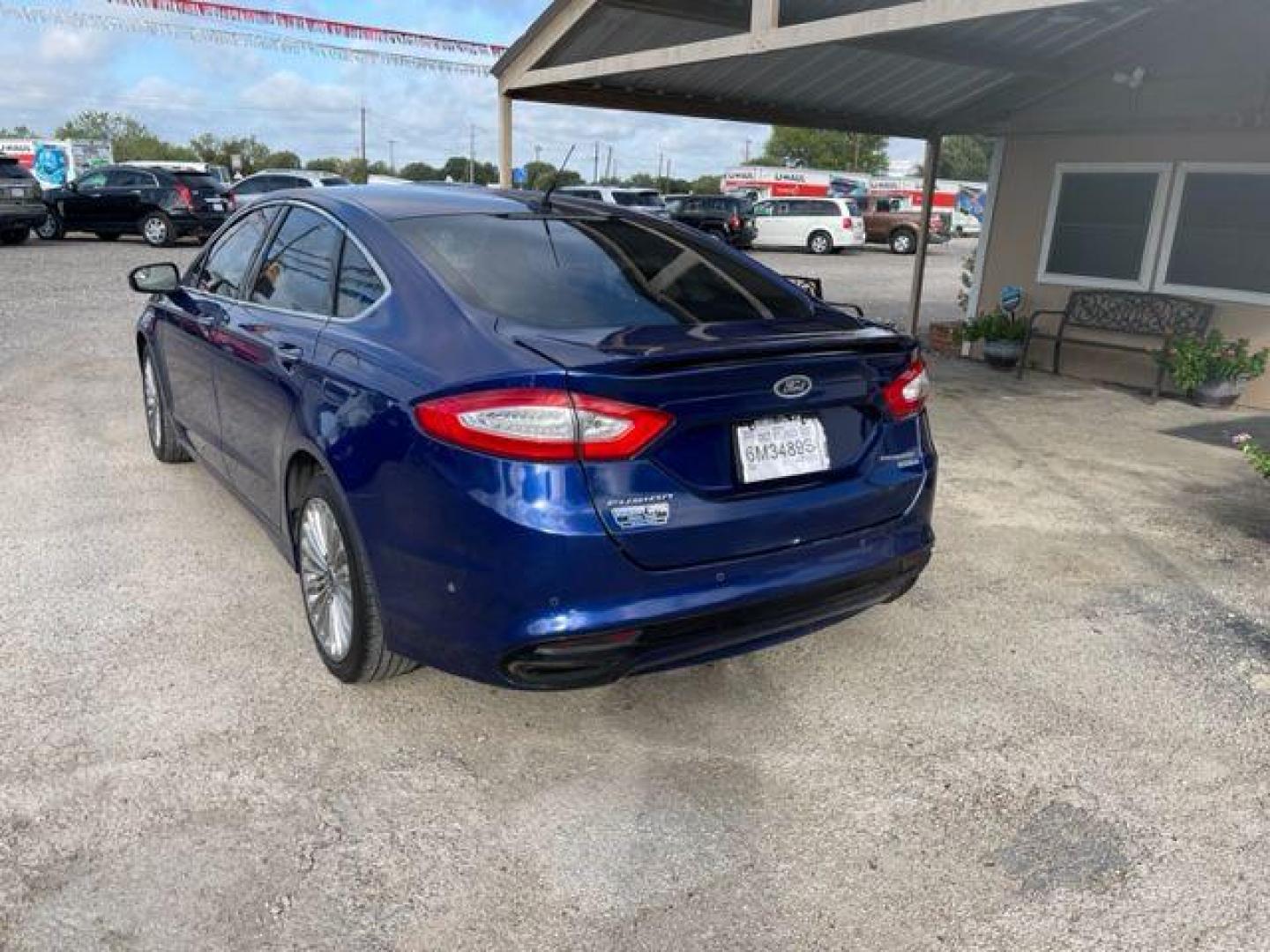 2014 BLUE FORD FUSION TITANIUM (3FA6P0D94ER) with an 2.0L engine, Automatic transmission, located at 124 Elm St., Cibolo, TX, 78108, (210) 658-3118, 29.559427, -98.232384 - www.discountautosinc.com TEXT QUESTIONS TO 210-900-3118 41 MONTHLY PAYMENTS OF $340 WITH $2495 DOWN AND FINAL ODD PAYMENT OF $25.03 W/FIRST PAYMENT DUE 30 DAYS FROM DATE OF SALE. FEATURES: ALL WHEEL DR, BACK UP CAMERA, HEATED LEATHER SEATS WARRANTY ON ENGINE and TRANSMISSION O - Photo#2