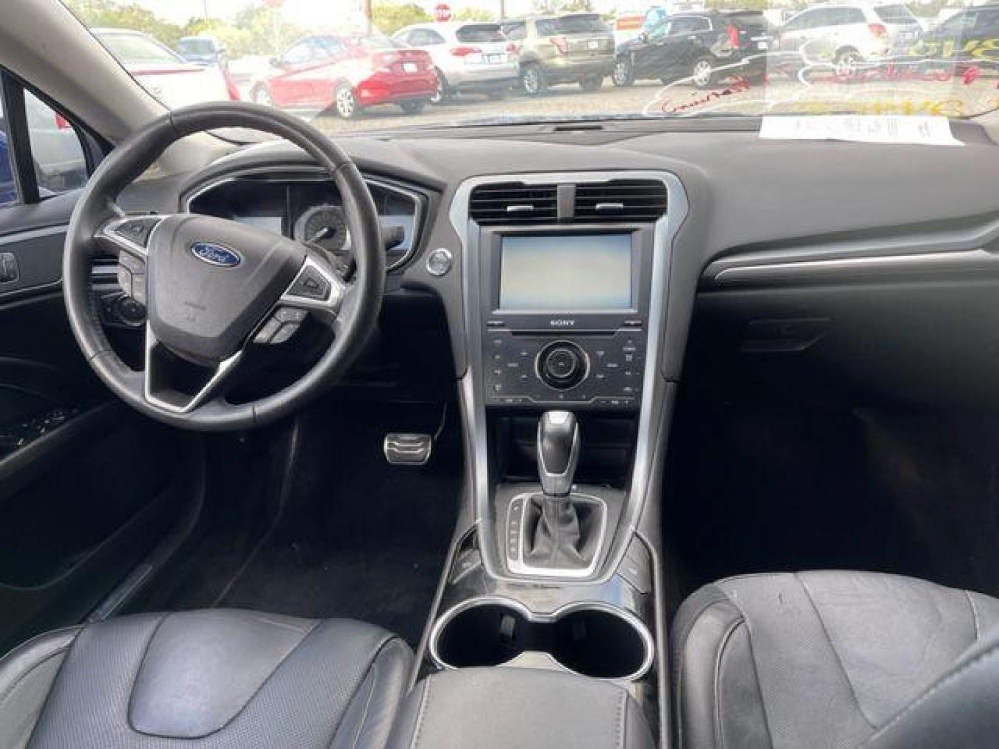 2014 BLUE FORD FUSION TITANIUM (3FA6P0D94ER) with an 2.0L engine, Automatic transmission, located at 124 Elm St., Cibolo, TX, 78108, (210) 658-3118, 29.559427, -98.232384 - www.discountautosinc.com TEXT QUESTIONS TO 210-900-3118 41 MONTHLY PAYMENTS OF $340 WITH $2495 DOWN AND FINAL ODD PAYMENT OF $25.03 W/FIRST PAYMENT DUE 30 DAYS FROM DATE OF SALE. FEATURES: ALL WHEEL DR, BACK UP CAMERA, HEATED LEATHER SEATS WARRANTY ON ENGINE and TRANSMISSION O - Photo#5