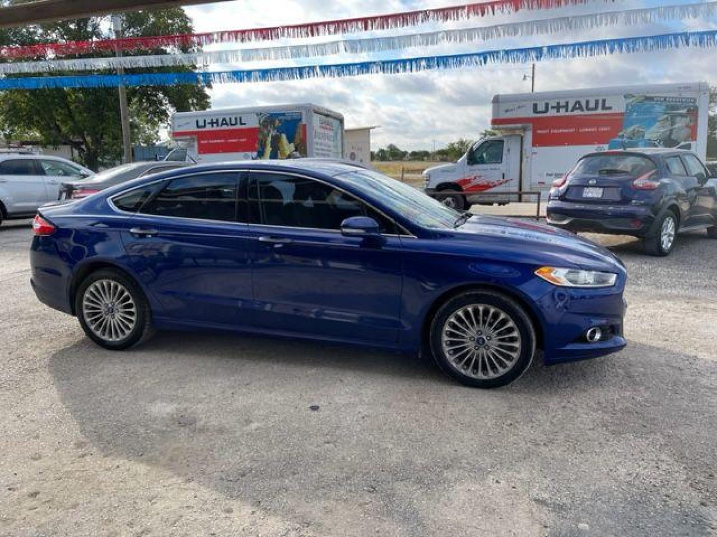 2014 BLUE FORD FUSION TITANIUM (3FA6P0D94ER) with an 2.0L engine, Automatic transmission, located at 124 Elm St., Cibolo, TX, 78108, (210) 658-3118, 29.559427, -98.232384 - www.discountautosinc.com TEXT QUESTIONS TO 210-900-3118 41 MONTHLY PAYMENTS OF $340 WITH $2495 DOWN AND FINAL ODD PAYMENT OF $25.03 W/FIRST PAYMENT DUE 30 DAYS FROM DATE OF SALE. FEATURES: ALL WHEEL DR, BACK UP CAMERA, HEATED LEATHER SEATS WARRANTY ON ENGINE and TRANSMISSION O - Photo#7