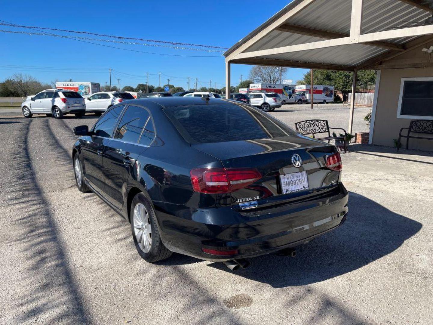 2016 BLACK VOLKSWAGEN JETTA SE (3VWD67AJ1GM) with an 1.4L engine, Automatic transmission, located at 124 Elm St., Cibolo, TX, 78108, (210) 658-3118, 29.559427, -98.232384 - www.discountautoscibolo.com TEXT 210-900-3118 41 MONTHLY PAYMENTS OF $320 WITH $2995 DOWN AND FINAL ODD PAYMENT OF $73.27 W/FIRST PAYMENT DUE 30 DAYS FROM DATE OF SALE. FEATURES: BACK UP CAMERA, SUN ROOF, HEATED LEATHER SEATS, BLUE TOOTH WARRANTY ON ENGINE and TRANSMISSION O - Photo#1