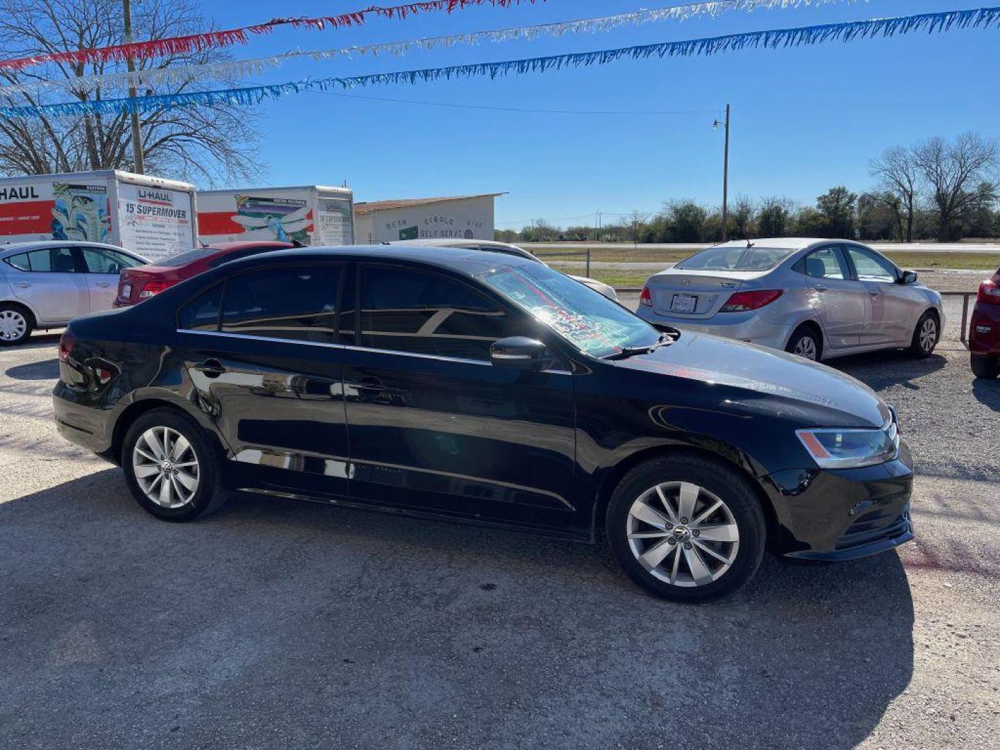 2016 BLACK VOLKSWAGEN JETTA SE (3VWD67AJ1GM) with an 1.4L engine, Automatic transmission, located at 124 Elm St., Cibolo, TX, 78108, (210) 658-3118, 29.559427, -98.232384 - www.discountautoscibolo.com TEXT 210-900-3118 41 MONTHLY PAYMENTS OF $320 WITH $2995 DOWN AND FINAL ODD PAYMENT OF $73.27 W/FIRST PAYMENT DUE 30 DAYS FROM DATE OF SALE. FEATURES: BACK UP CAMERA, SUN ROOF, HEATED LEATHER SEATS, BLUE TOOTH WARRANTY ON ENGINE and TRANSMISSION O - Photo#8