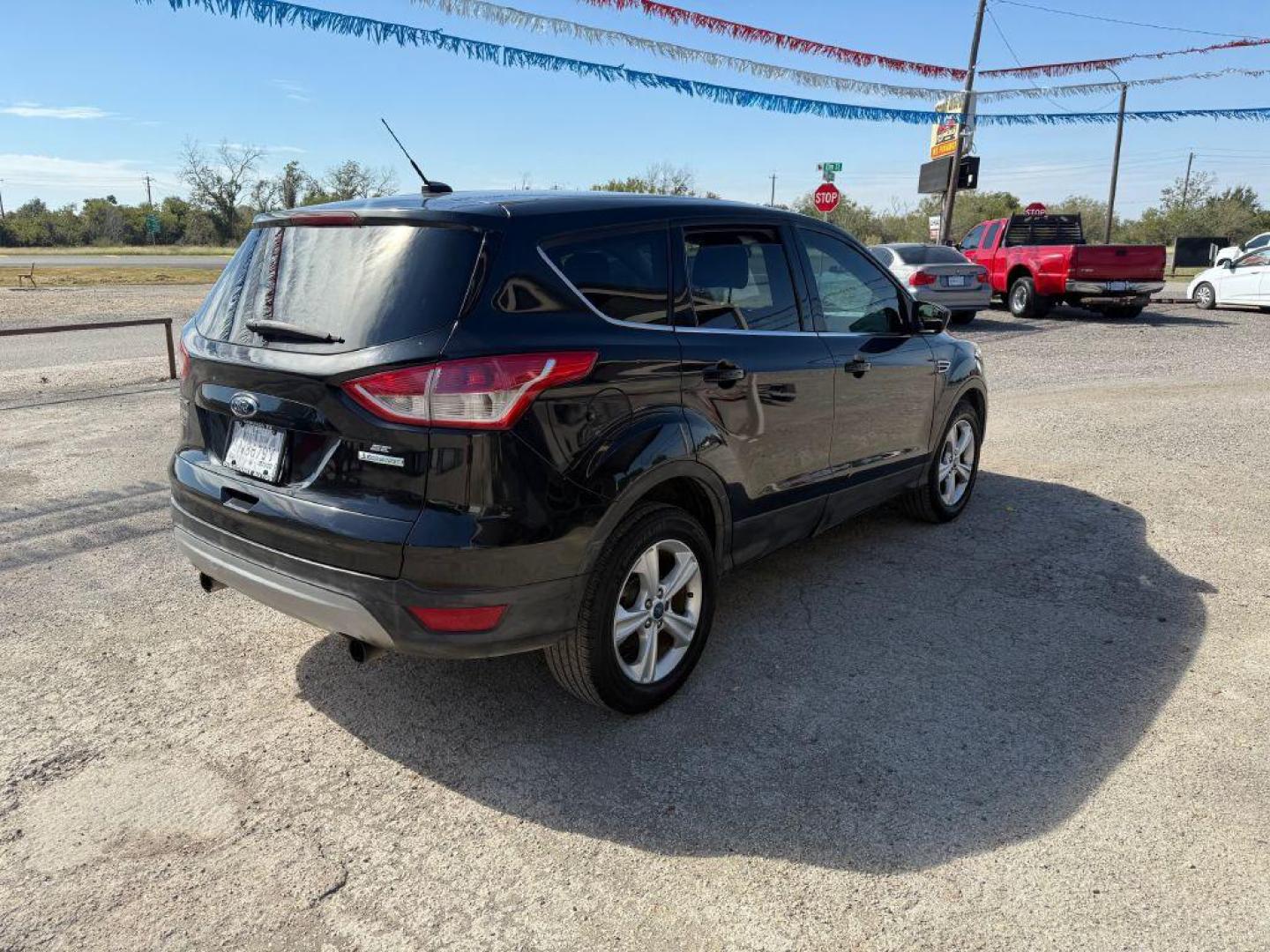 2013 BLACK FORD ESCAPE SE (1FMCU0G91DU) with an 2.0L engine, Automatic transmission, located at 124 Elm St., Cibolo, TX, 78108, (210) 658-3118, 29.559427, -98.232384 - www.discountautoscibolo.com TEXT QUESTIONS TO 210-900-3118 26 MONTHLY PAYMENTS OF $275 WITH $1195 DOWN AND FINAL ODD PAYMENT OF $216.86 W/FIRST PAYMENT DUE 30 DAYS FROM DATE OF SALE. ** NO WARRANTY, SOLD AS IS ** 27 MO'S TERM W/ 22.41 APR and TITLE TRANSFER FEE OF $175 DU - Photo#3