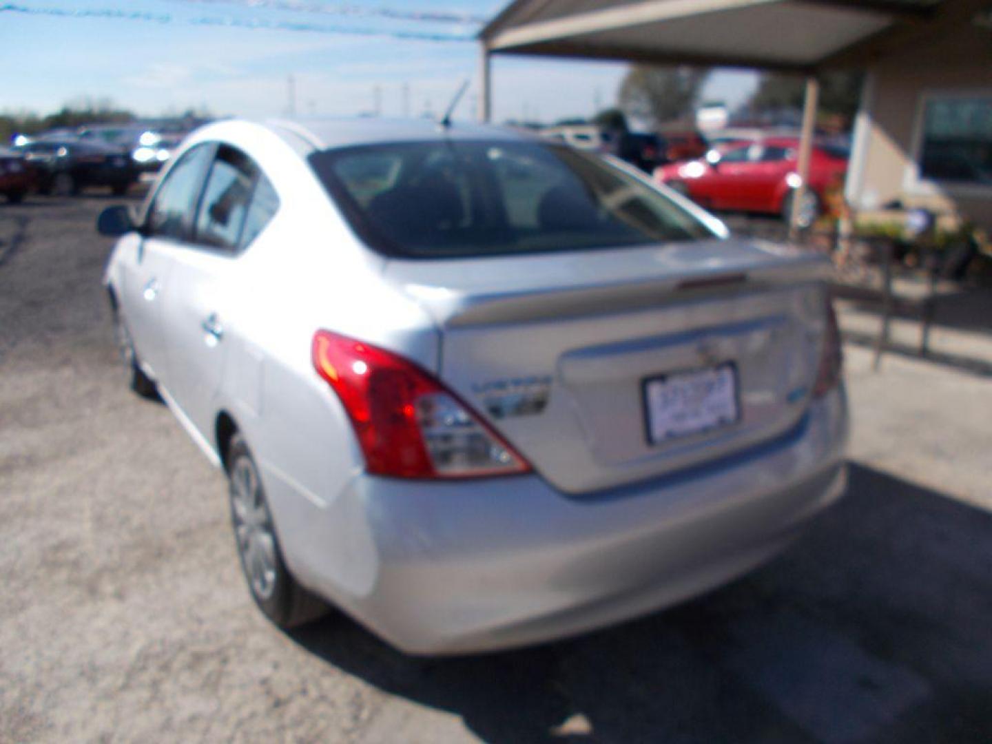 2014 SILVER NISSAN VERSA S (3N1CN7APXEL) with an 1.6L engine, Continuously Variable transmission, located at 124 Elm St., Cibolo, TX, 78108, (210) 658-3118, 29.559427, -98.232384 - www.discountautoscibolo.com TEXT QUESTIONS TO 210-900-3118 35 MONTHLY PAYMENTS OF $230 WITH $1495 DOWN AND FINAL ODD PAYMENT OF $187.35 W/FIRST PAYMENT DUE 30 DAYS FROM DATE OF SALE. ** NO WARRANTY, SOLD AS IS ** 36 MO'S TERM W/ 22.40 APR and TITLE TRANSFER FEE OF $195 DU - Photo#3