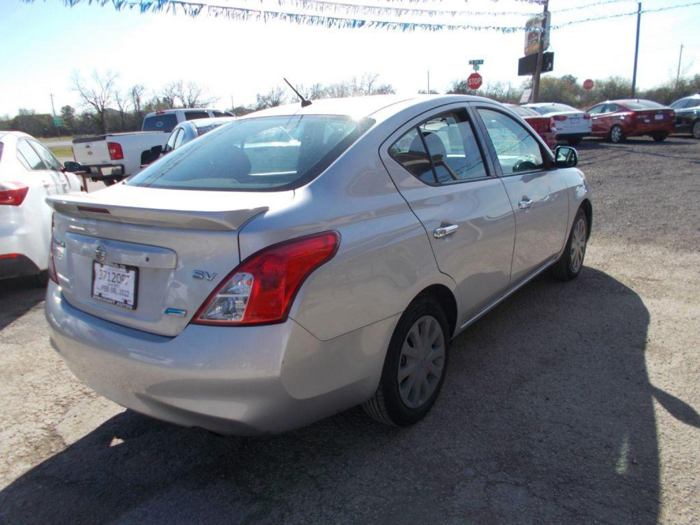 2014 SILVER NISSAN VERSA S (3N1CN7APXEL) with an 1.6L engine, Continuously Variable transmission, located at 124 Elm St., Cibolo, TX, 78108, (210) 658-3118, 29.559427, -98.232384 - www.discountautoscibolo.com TEXT QUESTIONS TO 210-900-3118 35 MONTHLY PAYMENTS OF $230 WITH $1495 DOWN AND FINAL ODD PAYMENT OF $187.35 W/FIRST PAYMENT DUE 30 DAYS FROM DATE OF SALE. ** NO WARRANTY, SOLD AS IS ** 36 MO'S TERM W/ 22.40 APR and TITLE TRANSFER FEE OF $195 DU - Photo#4