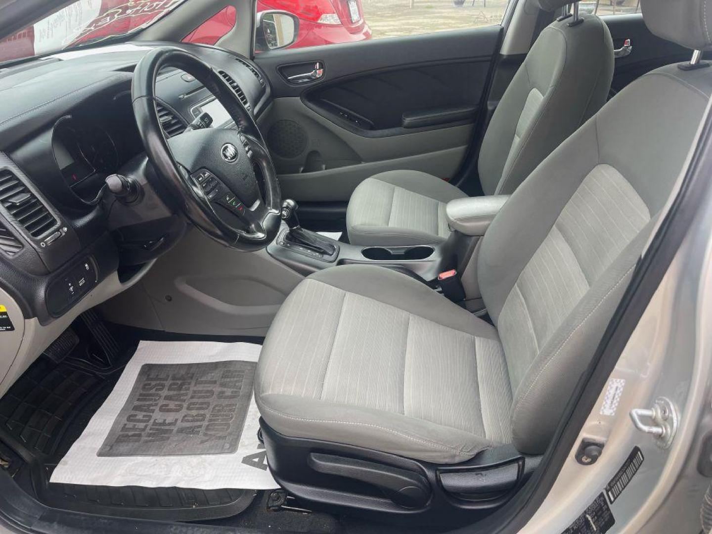 2014 SILVER KIA FORTE EX (KNAFX4A84E5) with an 2.0L engine, Automatic transmission, located at 124 Elm St., Cibolo, TX, 78108, (210) 658-3118, 29.559427, -98.232384 - www.discountautoscibolo.com TEXT QUESTIONS TO 210-900-3118 35 MONTHLY PAYMENTS OF $300 WITH $1895 DOWN AND FINAL ODD PAYMENT OF $21.45 W/FIRST PAYMENT DUE 30 DAYS FROM DATE OF SALE. FEATURES: BACK UP CAMERA ** NO WARRANTY, SOLD AS IS ** 36 MO'S TERM W/ 22.40 APR and TITLE - Photo#1