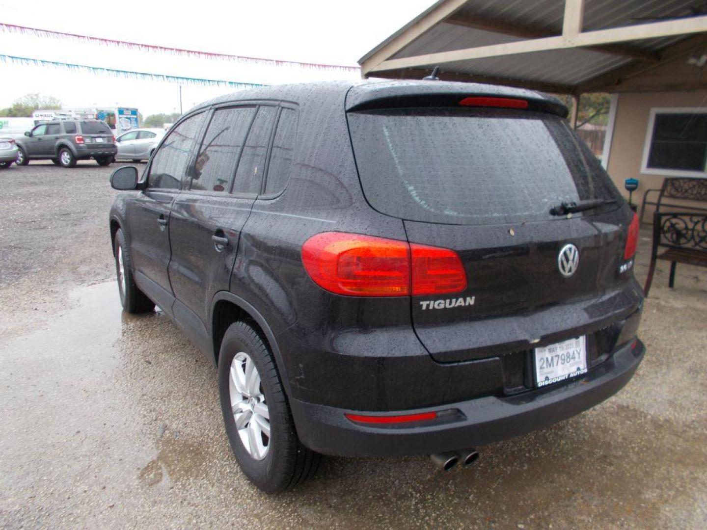 2013 BLACK VOLKSWAGEN TIGUAN S (WVGAV3AX4DW) with an 2.0L engine, Automatic transmission, located at 124 Elm St., Cibolo, TX, 78108, (210) 658-3118, 29.559427, -98.232384 - www.discountautoscibolo.com TEXT QUESTIONS TO 210-900-3118 41 MONTHLY PAYMENTS OF $320 WITH $1495 DOWN AND FINAL ODD PAYMENT OF $147.25 W/FIRST PAYMENT DUE 30 DAYS FROM DATE OF SALE. ** NO WARRANTY, SOLD AS IS ** 42 MO'S TERM W/ 22.54 APR and TITLE TRANSFER FEE OF $195 DUE TW - Photo#3