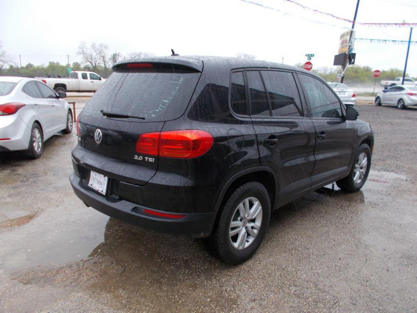 2013 BLACK VOLKSWAGEN TIGUAN S (WVGAV3AX4DW) with an 2.0L engine, Automatic transmission, located at 124 Elm St., Cibolo, TX, 78108, (210) 658-3118, 29.559427, -98.232384 - www.discountautoscibolo.com TEXT QUESTIONS TO 210-900-3118 41 MONTHLY PAYMENTS OF $320 WITH $1495 DOWN AND FINAL ODD PAYMENT OF $147.25 W/FIRST PAYMENT DUE 30 DAYS FROM DATE OF SALE. ** NO WARRANTY, SOLD AS IS ** 42 MO'S TERM W/ 22.54 APR and TITLE TRANSFER FEE OF $195 DUE TW - Photo#4